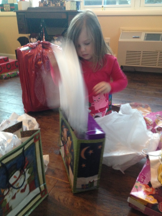 Furiously ripping into presents. Everything she opened, she responded with "it's just what I wanted." So sweet. 